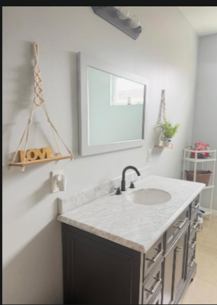 Clean bathroom vanity with marble countertop