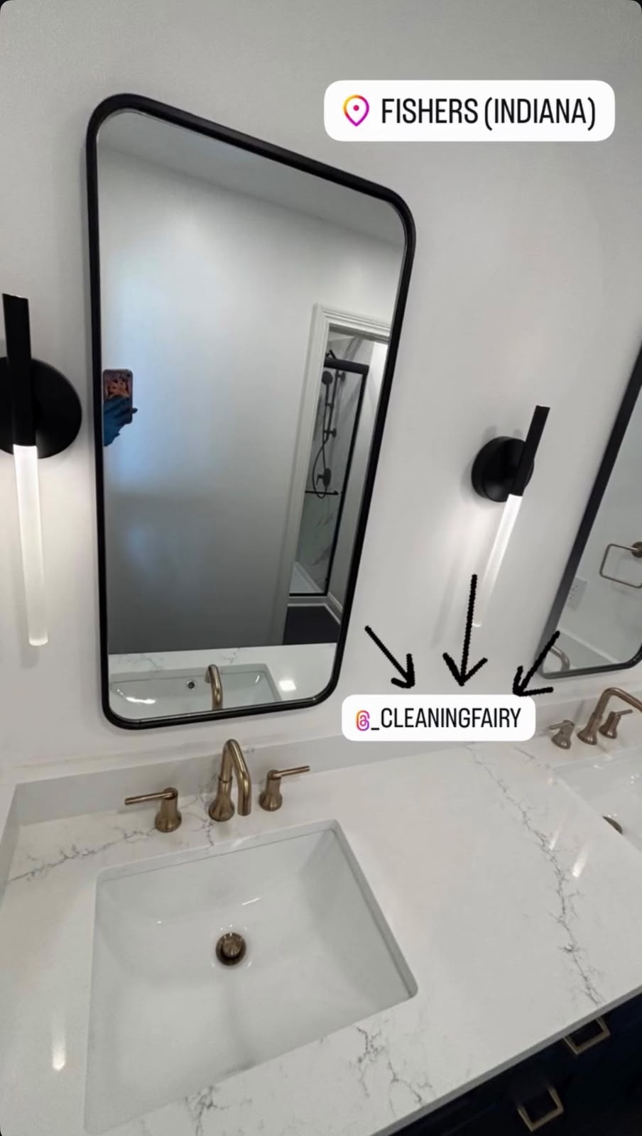 Freshly cleaned bathroom vanity with marble countertop and gold faucets
