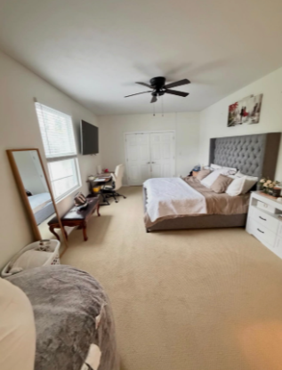 Freshly cleaned bedroom with neatly made bed